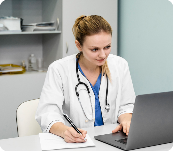 healthcare provider taking notes from EMR eCarehealth EMR software